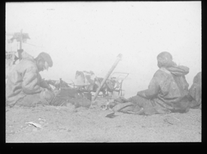 Image of Camp site activity for two Inuit